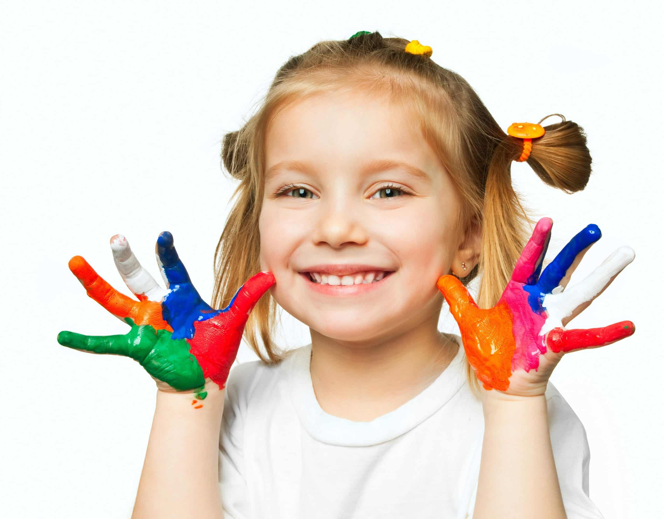 Little girl with hands painted at a day care